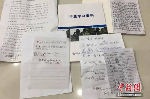 图为警方在南宁市西乡塘区鲁班路某小区查获涉嫌传销人员及涉案物品一批。